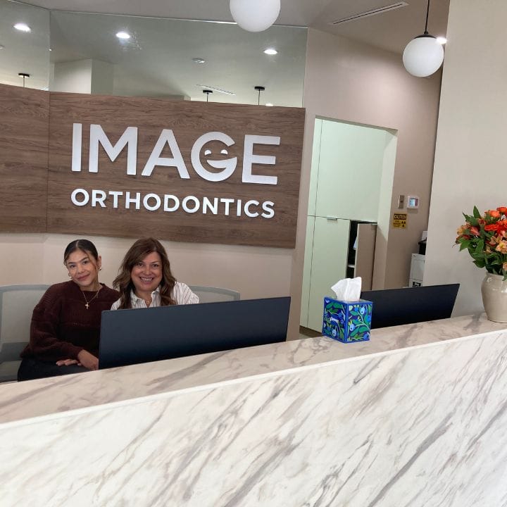Team members at the front desk of Mission District orthodontist.