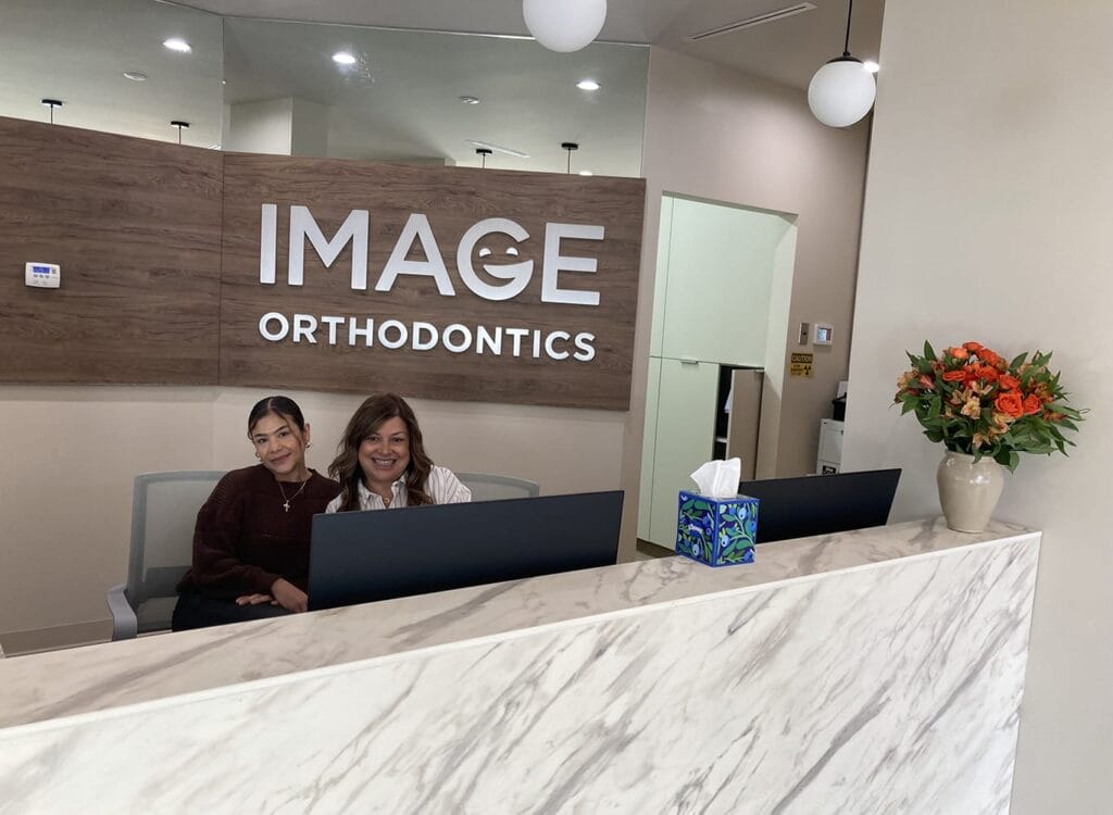 Monica Real (Practice Manager) and Ada Pacheco (Patient Coordinator) in the front desk at Image Orthodontics Folsom St.