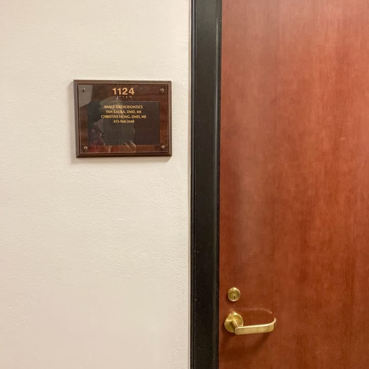 Outside plaque indicating where the Image Orthodontics' Post Street clinic is located.