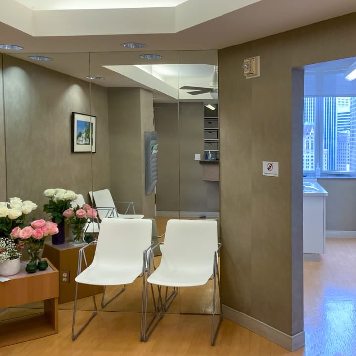 A different waiting area (with two chairs and flowers) at Image Orthodontic's Post Street clinic.