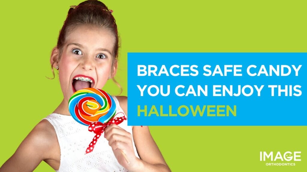 Girl with metal braces wearing a Halloween costume eating candy.