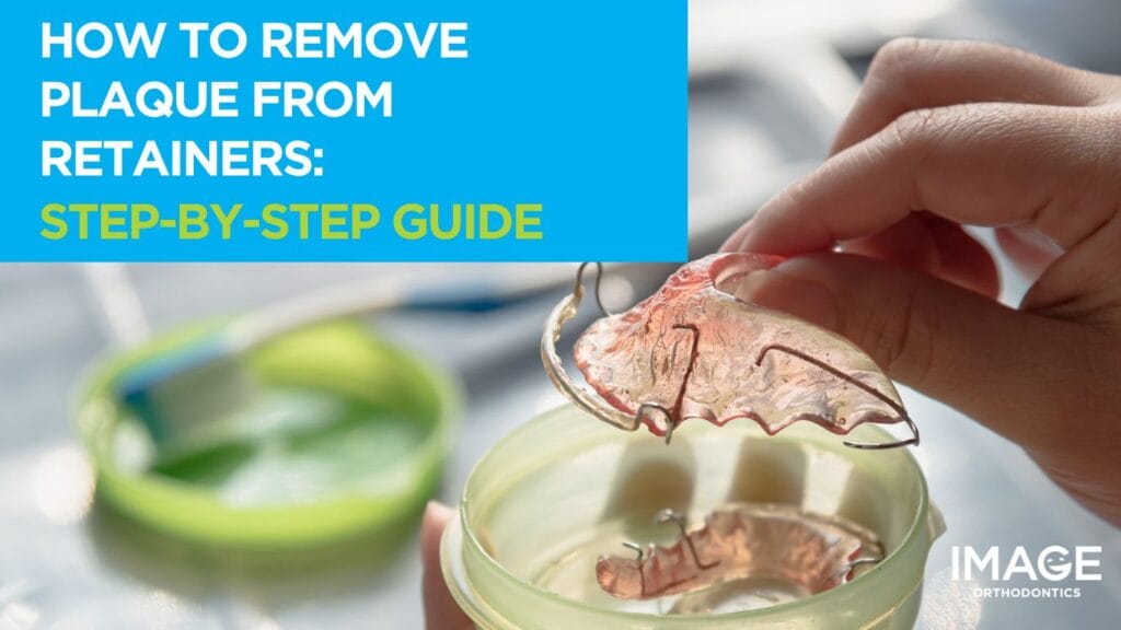 Hand placing a clear orthodontic retainer into a storage case, with another retainer inside