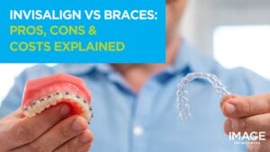 A man holding a dental model with metal braces in one hand and a clear Invisalign aligner in the other